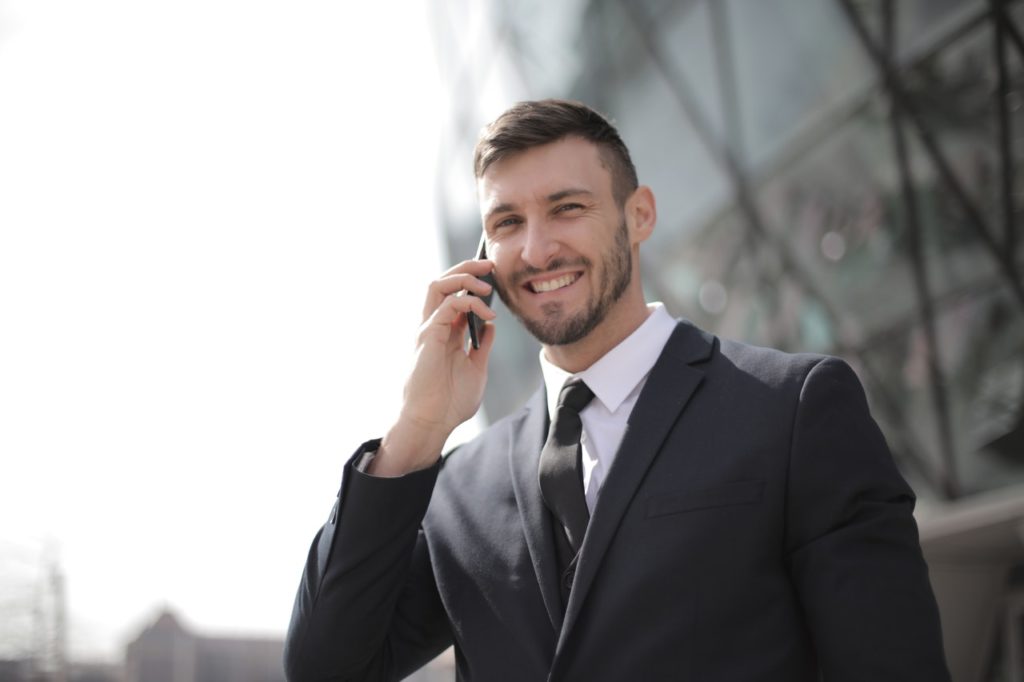 photo of man talking on mobile phone